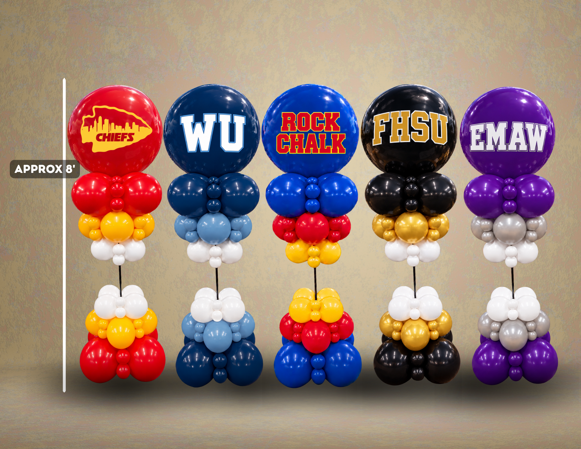 Five game day balloon columns, each about 8 feet tall, in team colors: Kansas City red and gold, Washburn navy and blue, KU "Rock Chalk" blue and red, Fort Hays State black and gold, and K-State "EMAW" purple. Available for pickup or delivery in Topeka from Vubbix.